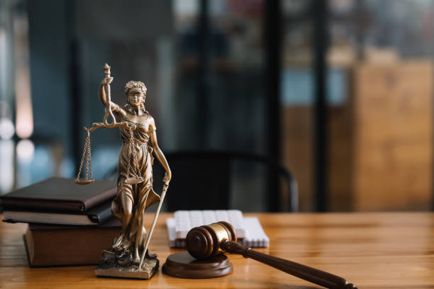 Statue of lady justice on desk of a judge or lawyer
